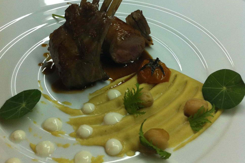 Milk fed lamb with chickpeas puree and goat cheese cream.